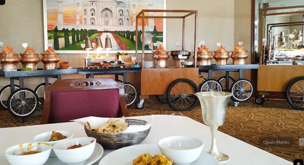 Perched atop the Rembrandt Hotel, Rang Mahal offers panoramic views of Bangkok